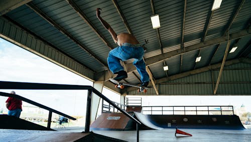 A Man Midair with His Skateboard