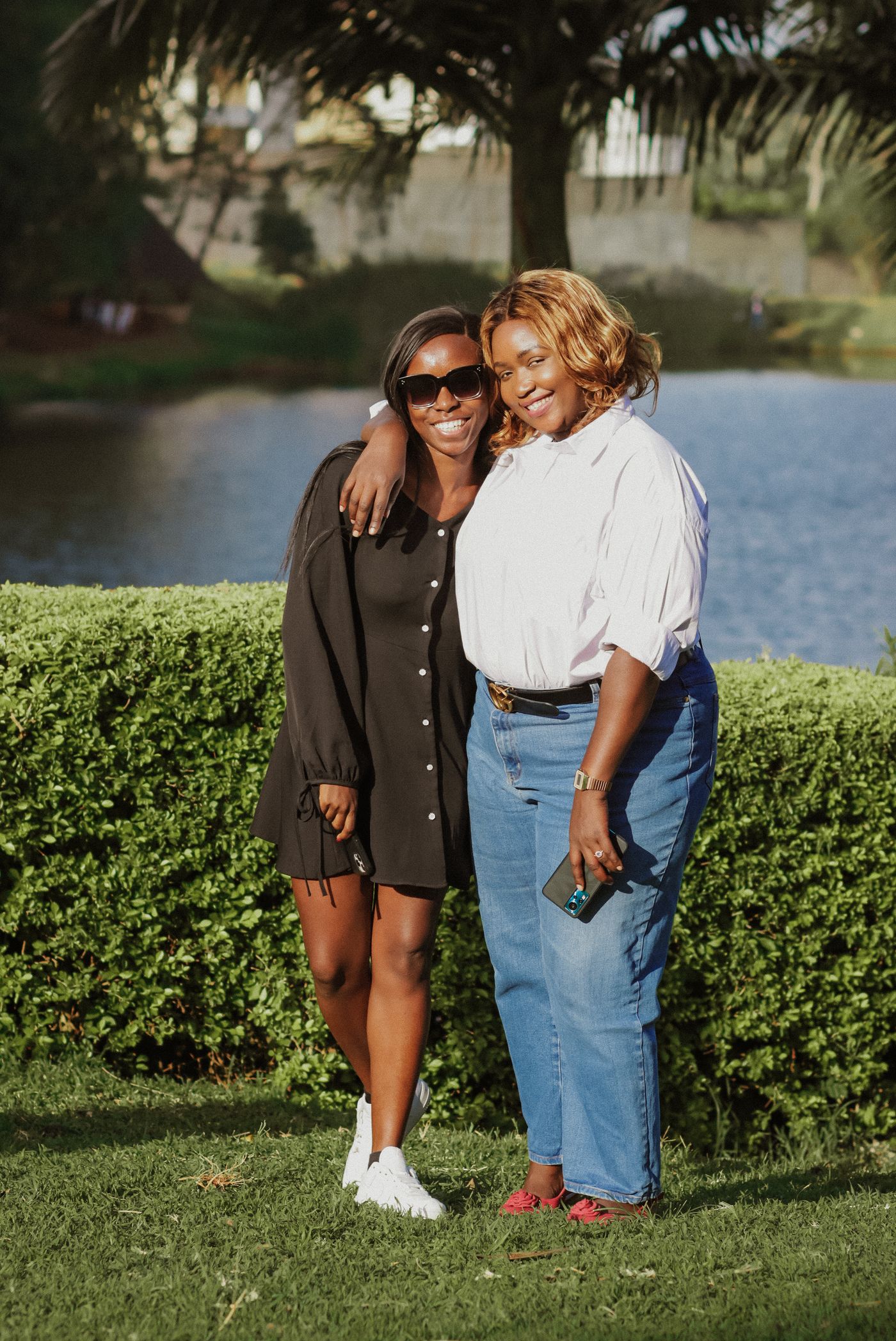 African friends outdoors in Nairobi enjoying a quiet moment together