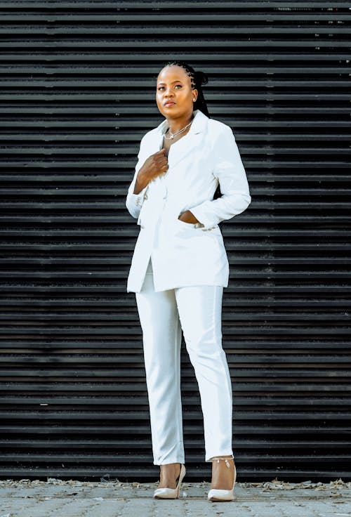 Photo of a Woman in a White Suit