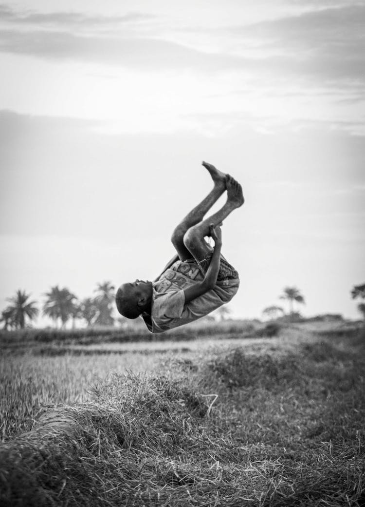 Man Jumping In Air On Field