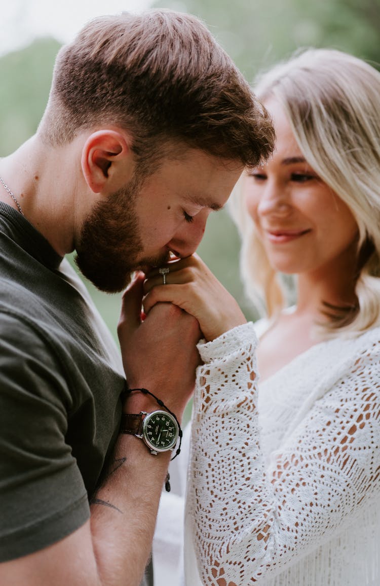 Man Kissing His Fiancees Hand 