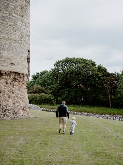 Free father and son walking together Stock Photo