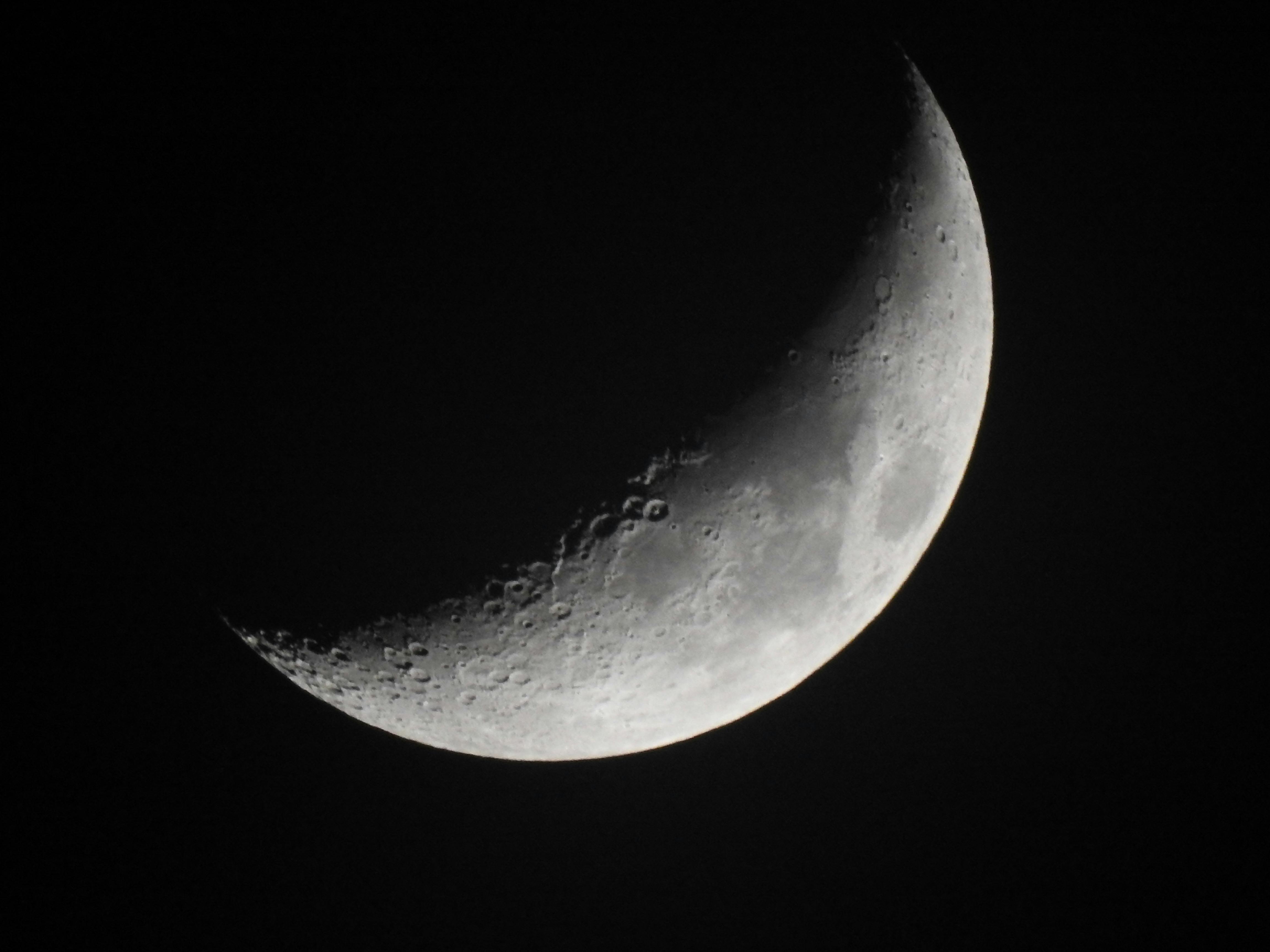 Grayscale Photo of a Crescent Moon · Free Stock Photo