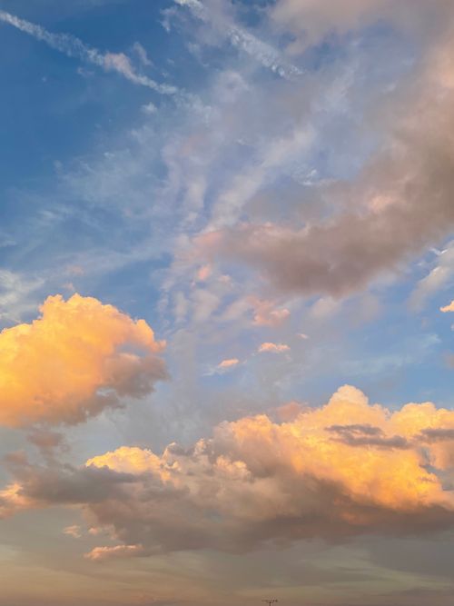 Free Beautiful sunset cloudscape with vibrant hues over Grand Est, France. Perfect for serene atmosphere. Stock Photo