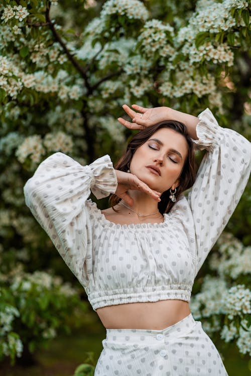 Free Portrait of Beautiful Woman in Blooming Orchard Stock Photo