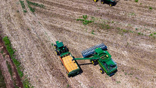 An Aerial Photography of a Tractor on Cornfield
