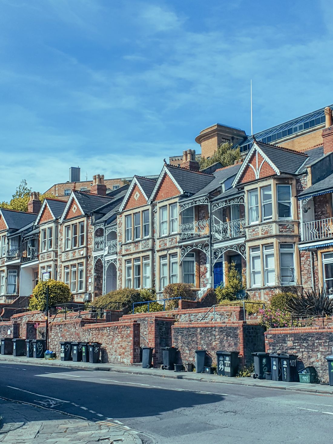 Victorian terraced houses with sash windows under a clear sky in England