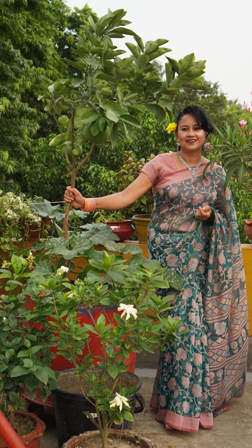 A Woman Holding a Plant