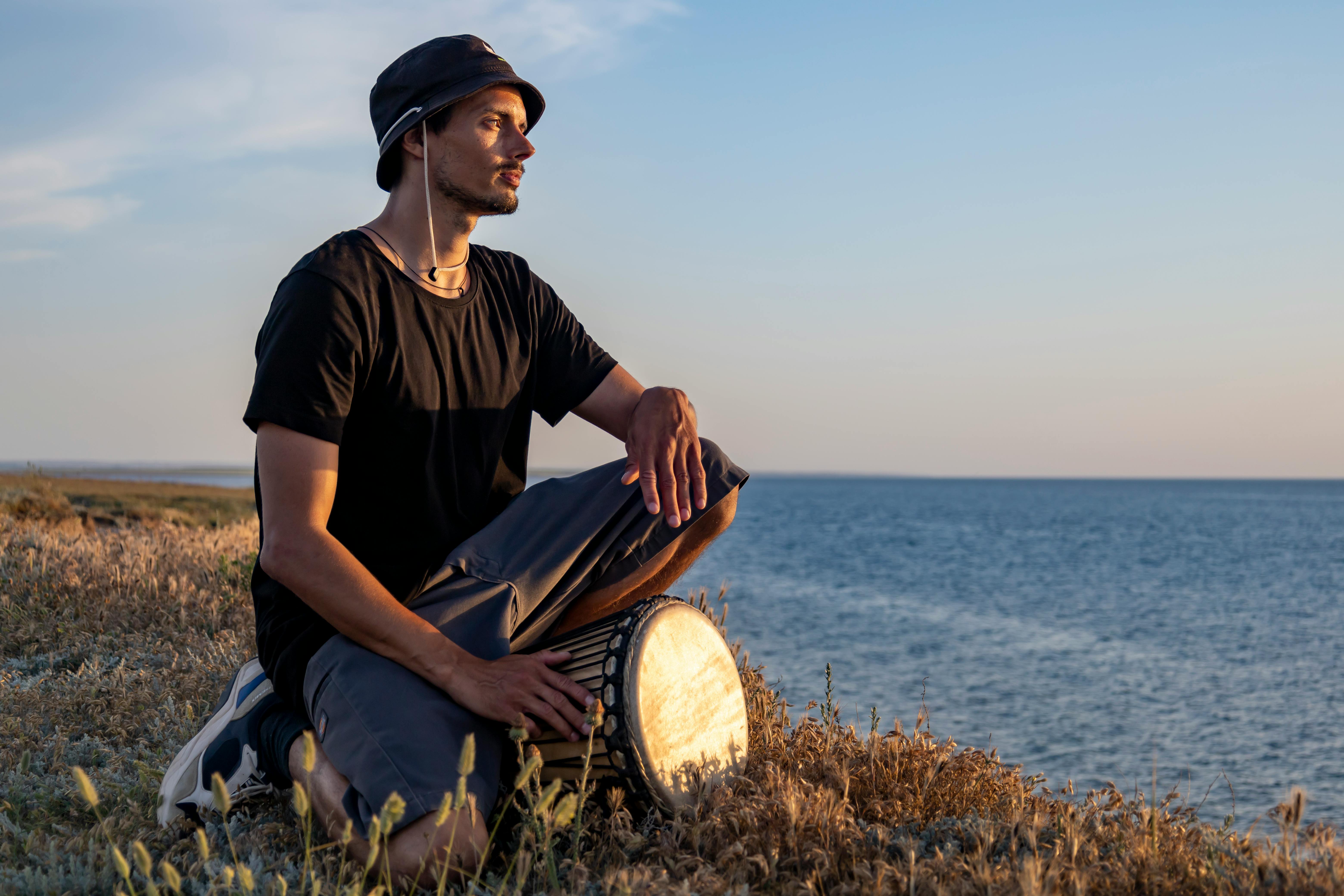 Person meditating with musical notes fading away from their head