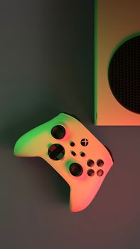 Close-up of a game controller and console with vibrant lighting, ideal for gaming enthusiasts.