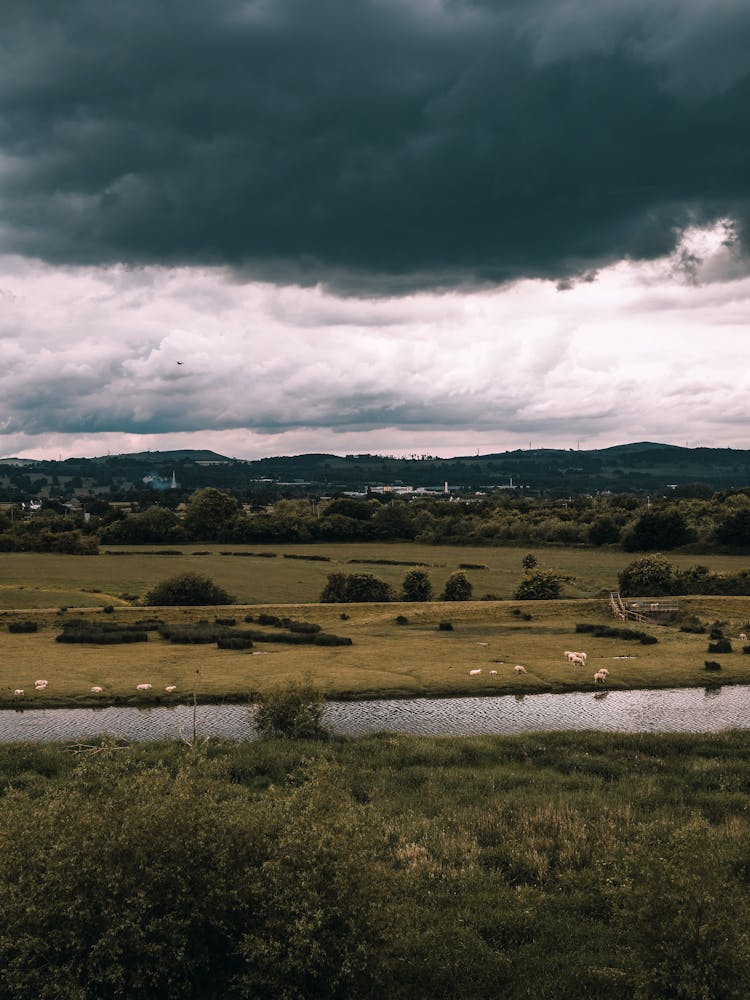 Landscape With River And Storm Cloud