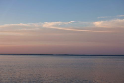 Free Peaceful sunrise over the calm waters of Stamford Sound, Connecticut. Stock Photo