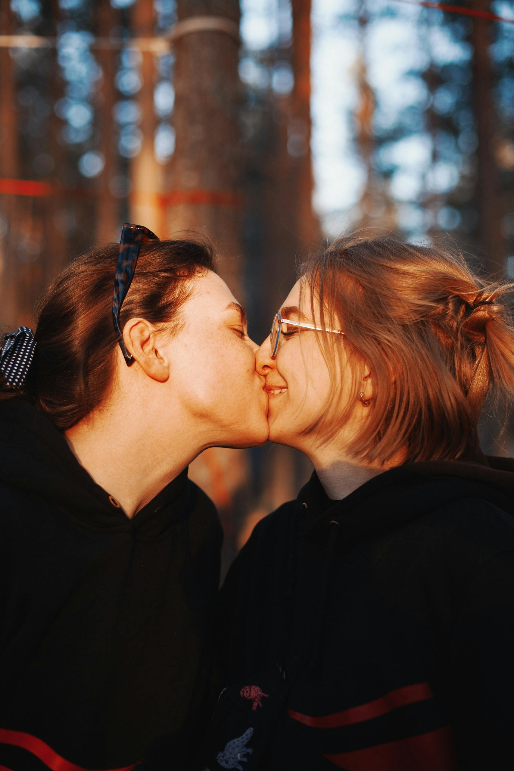 happy couple kissing on autumn day