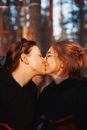 Happy Couple Kissing on Autumn Day
