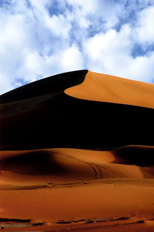 Free A Desert Under a Cloudy Sky Stock Photo