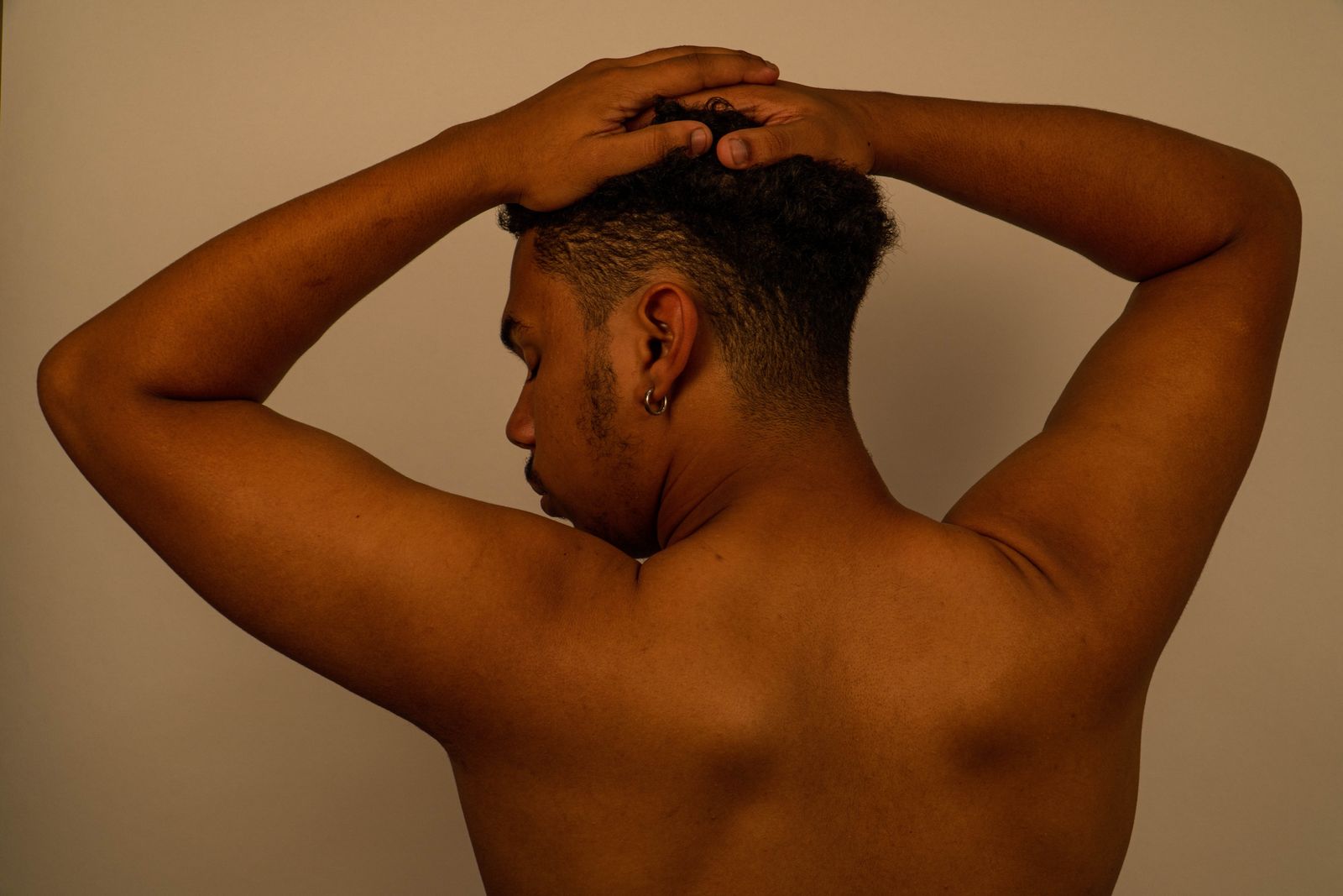 Bright home physiotherapy setting with a person preparing gentle lower back movement