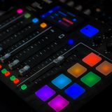 Illuminated audio mixing console — photo by Abdullah Alsaibaie on Pexels