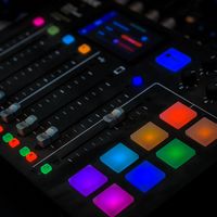 Illuminated audio mixer pads — photo by Abdullah Alsaibaie on Pexels