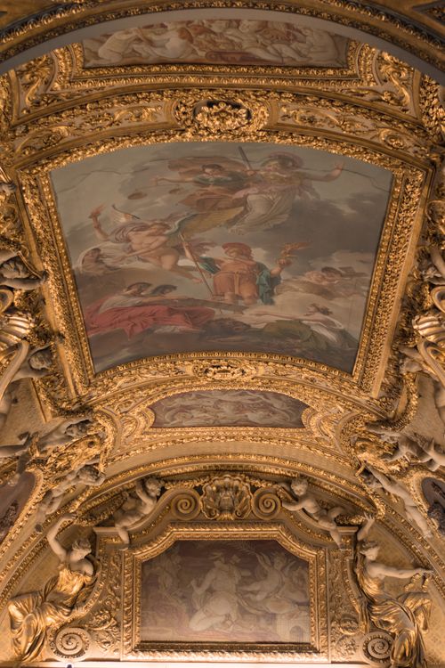 Free Stunning baroque ceiling with elaborate gold ornaments and classical paintings. Stock Photo