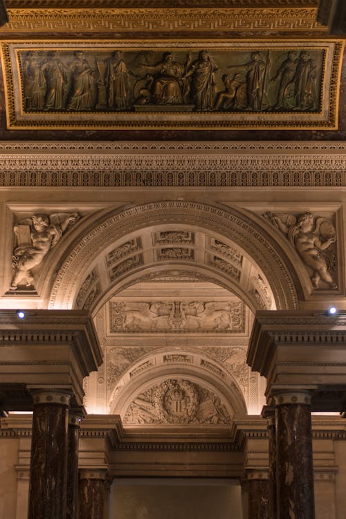 Ornate Interior of Louvre Museum Decorated with Bas-reliefs