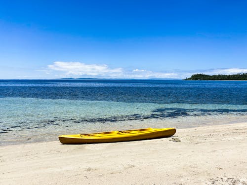 Free Kayak on White Sand Beach Stock Photo