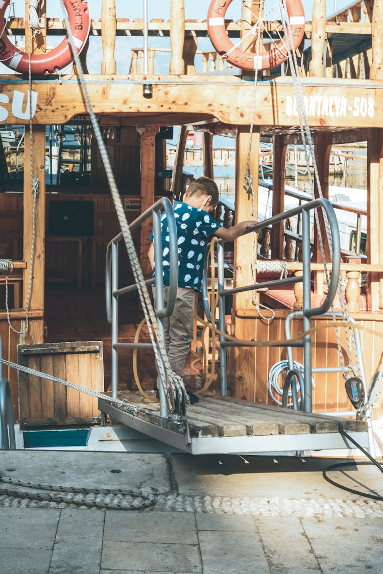 Little Boy Entering Boat