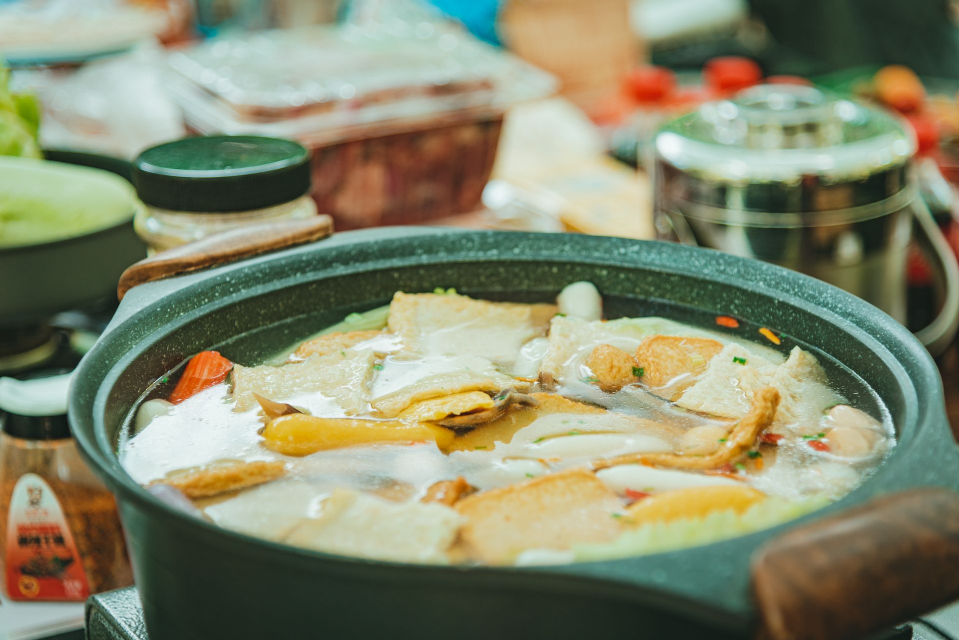 A delicious homemade soup simmering in a pot with fresh ingredients.