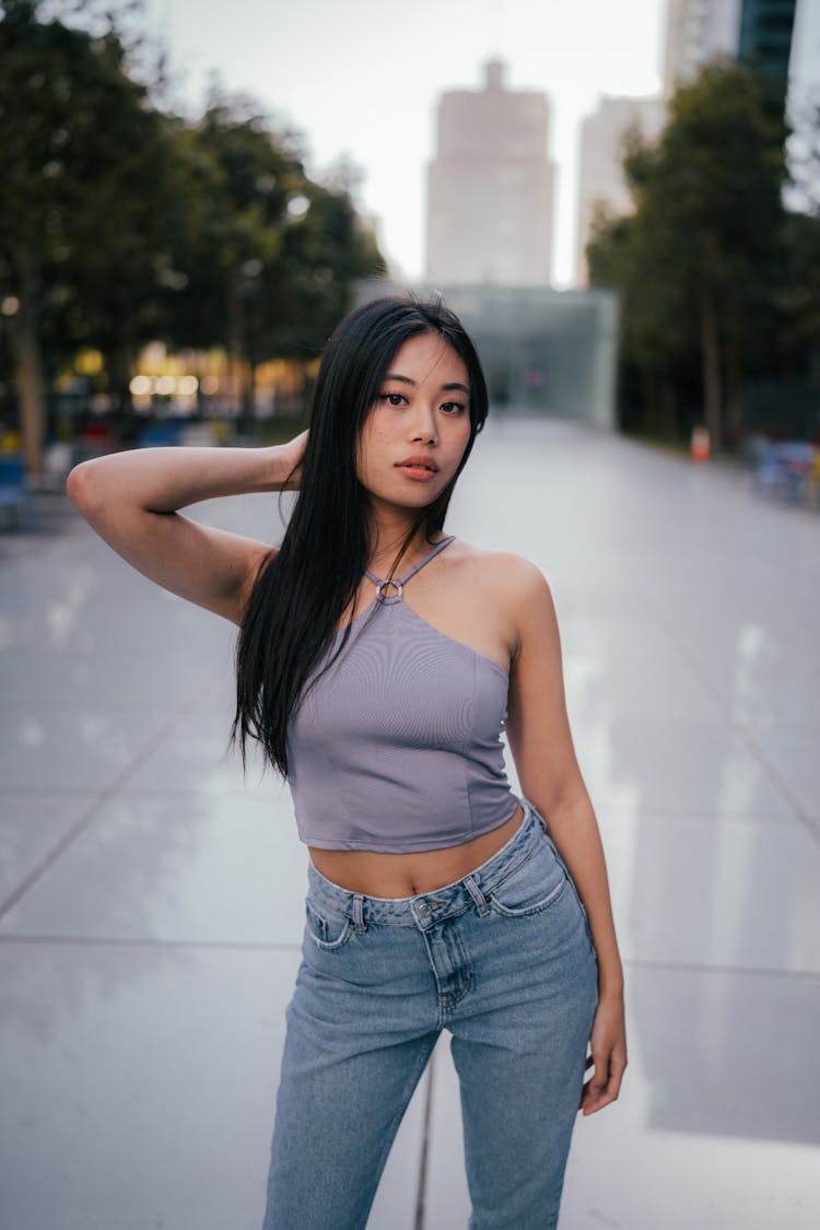 Portrait Of A Woman Wearing Jeans And A Top