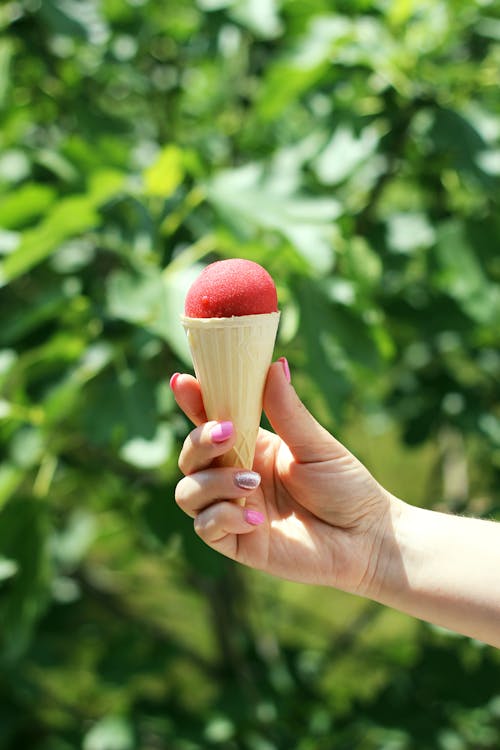 Hand Holding an Ice Cream Cone