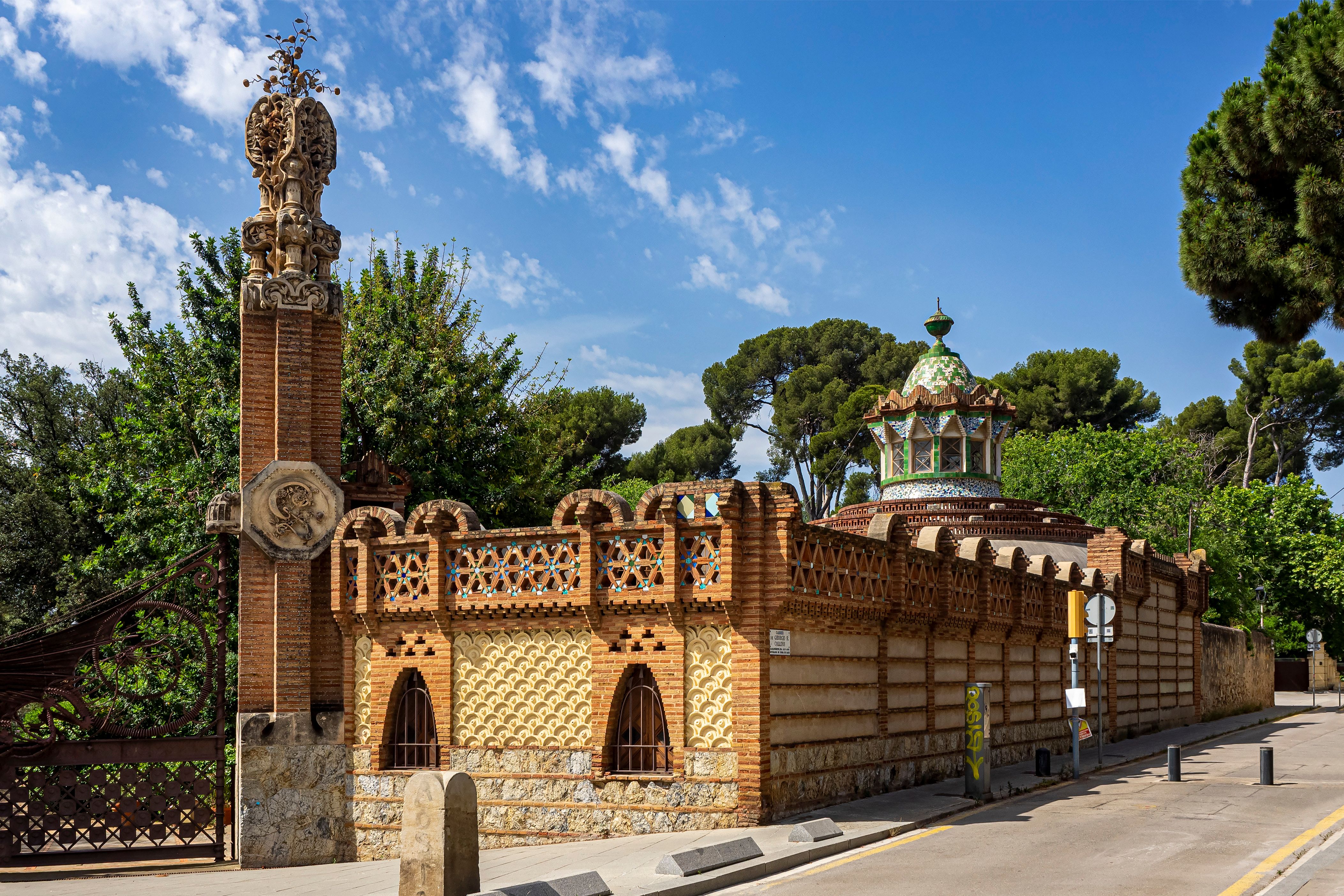 Guell Pavilions in Barcelona showcase unique architectural style under a clear sky.