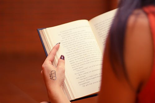 A Person Holding an Open Book