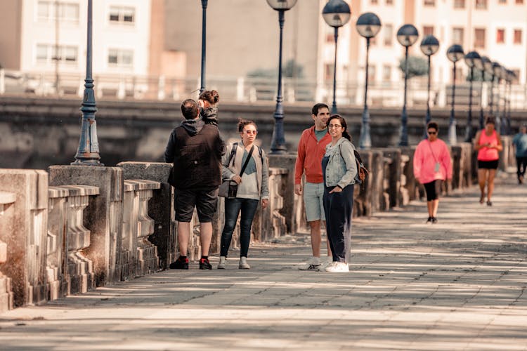 Family With A Small Child On A Promenade