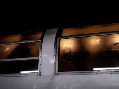 Photo of Steamy Windows on a Grey Facade of a Vehicle in the Dark