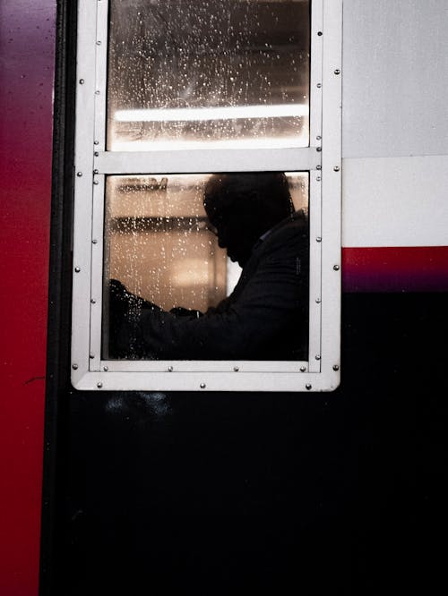Man Seen through Train Window