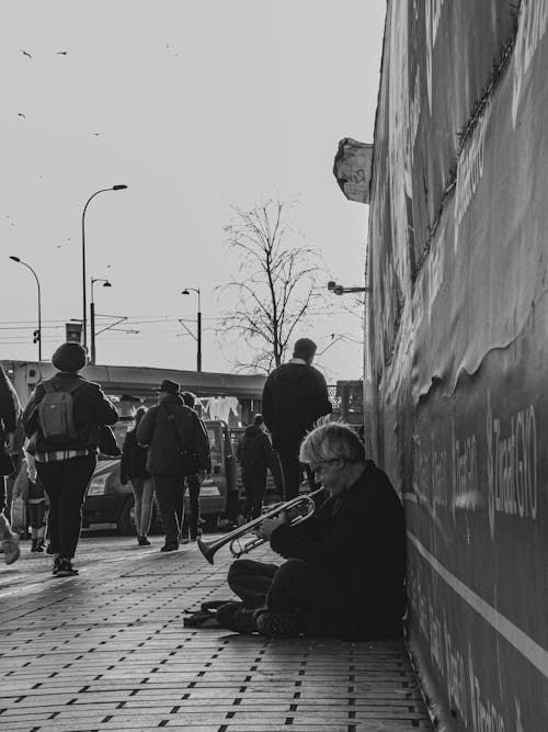 Busker Playing Trumpet on Pavement