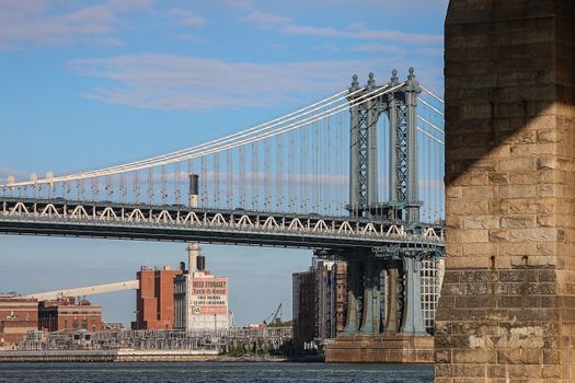 Capture of the iconic Manhattan Bridge spanning the East River in New York City. Architectural masterpiece.