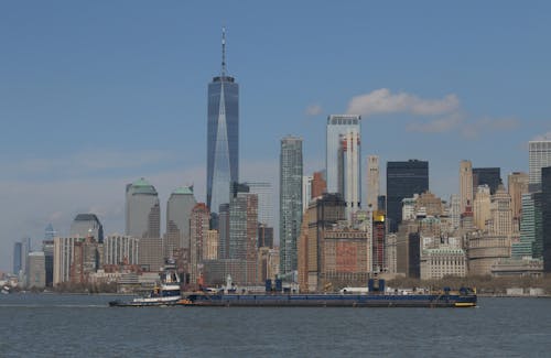 Free City Skyline Across Body of Water Stock Photo