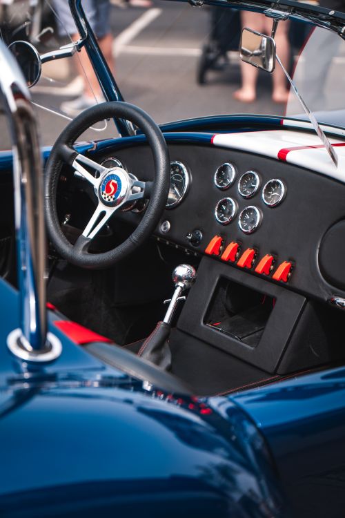 Free Close-up of a vintage Shelby Cobra car interior showcasing dashboard and steering wheel. Stock Photo