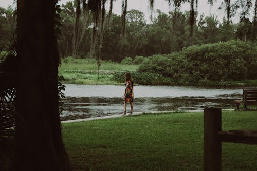 Free Photo of a Woman Walking at the Water in the Park Stock Photo