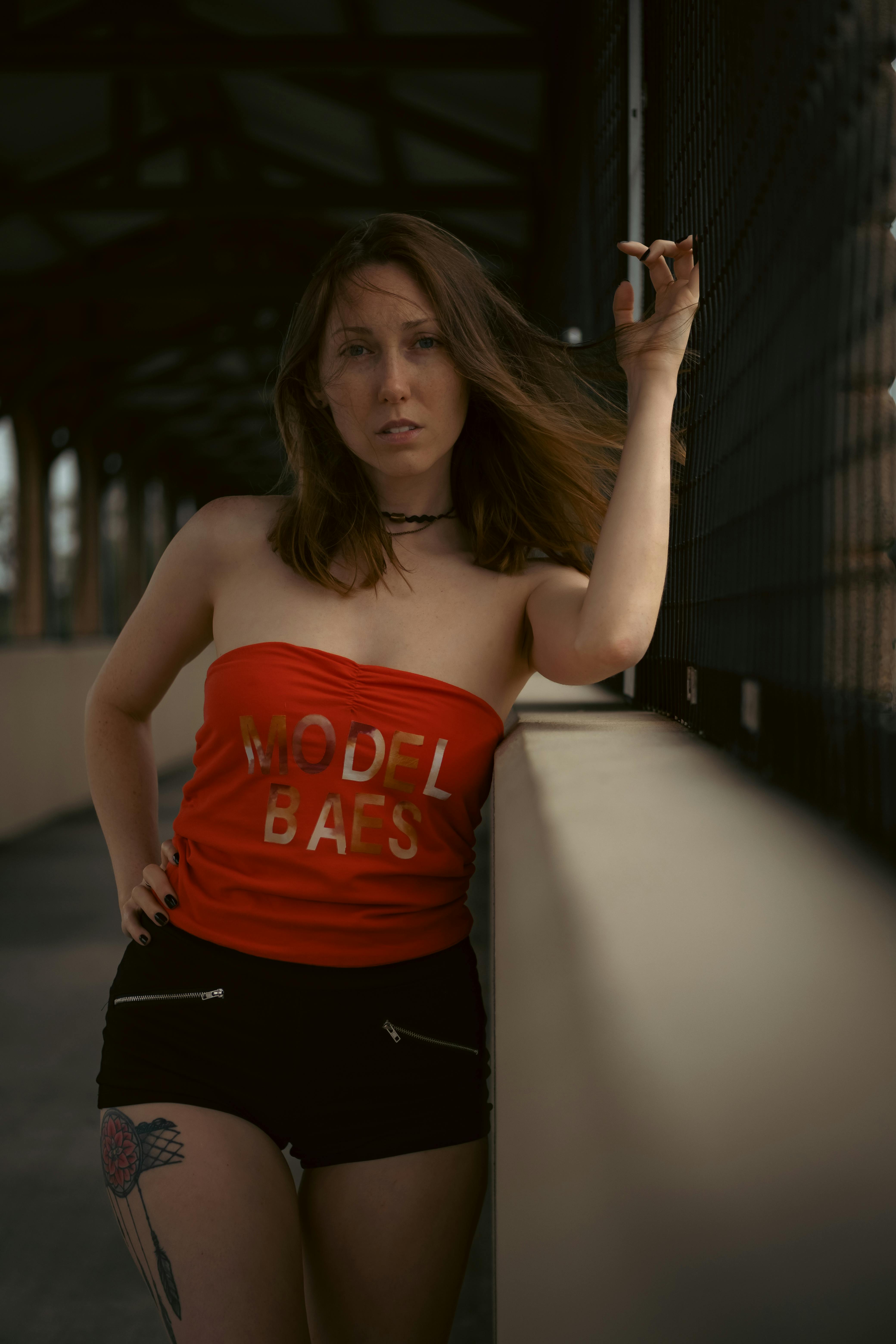 Woman in Red Tube Top and Black Shorts · Free Stock Photo