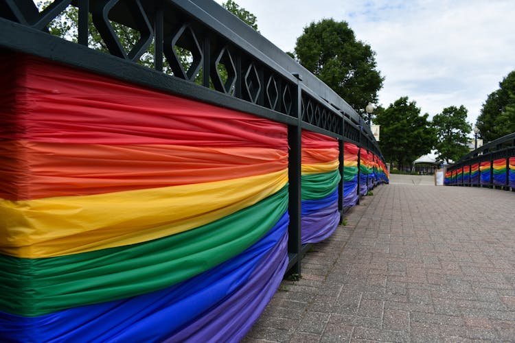 Rainbow Flags On A Railing