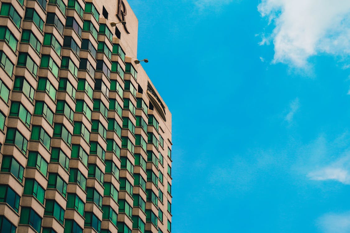 Foto profissional grátis de arquitetura, arranha-céu, artigos de vidro