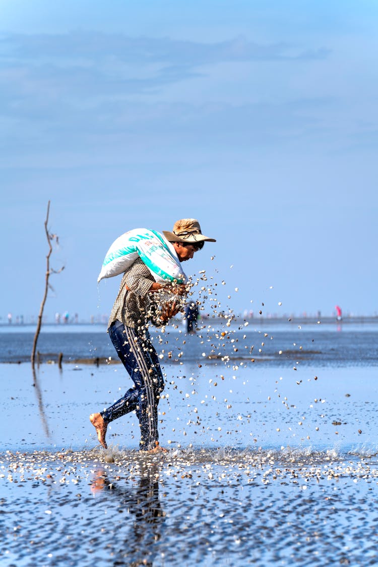 A Man Carrying A Bag