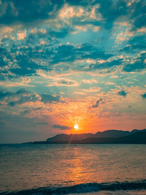 Бесплатное стоковое фото с красивый закат, пляжный закат, синий океан