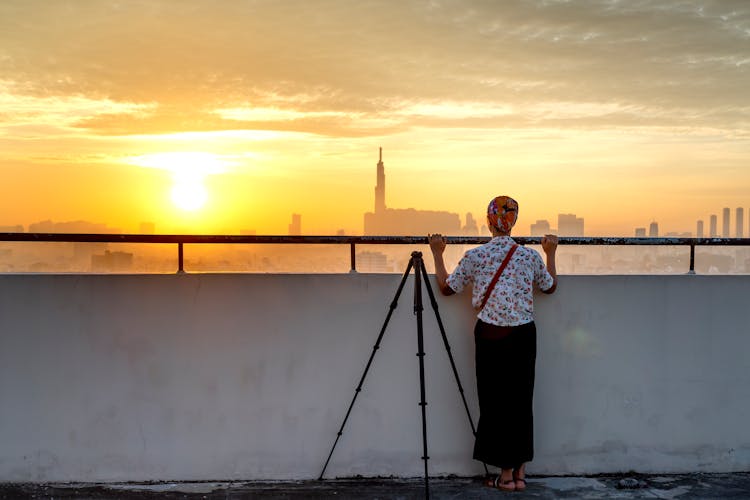 Woman Looking Over The Railing