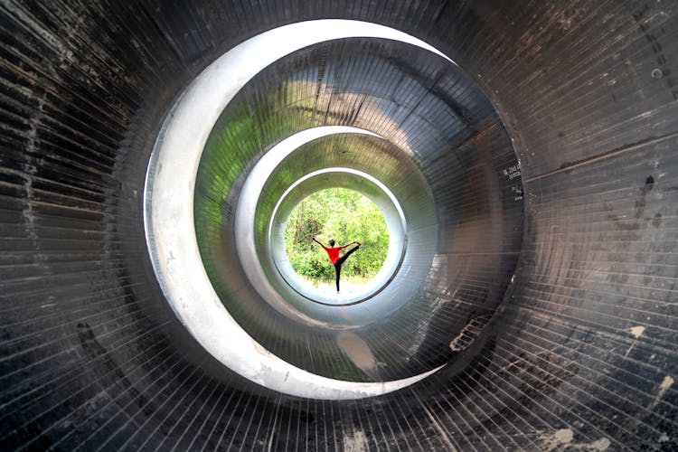 Person Stretching In Tube