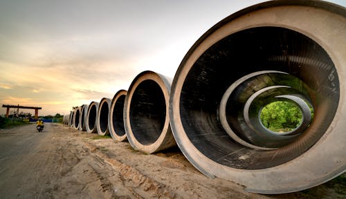 Gratis lagerfoto af betonrør, industri, mudder