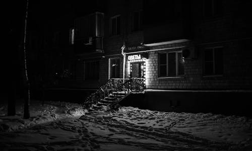 Grayscale Photo of a Store Front