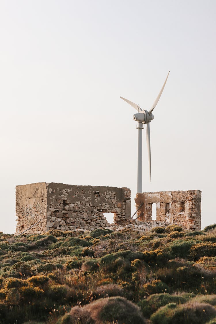 Wind Turbine At Ruins Of Building