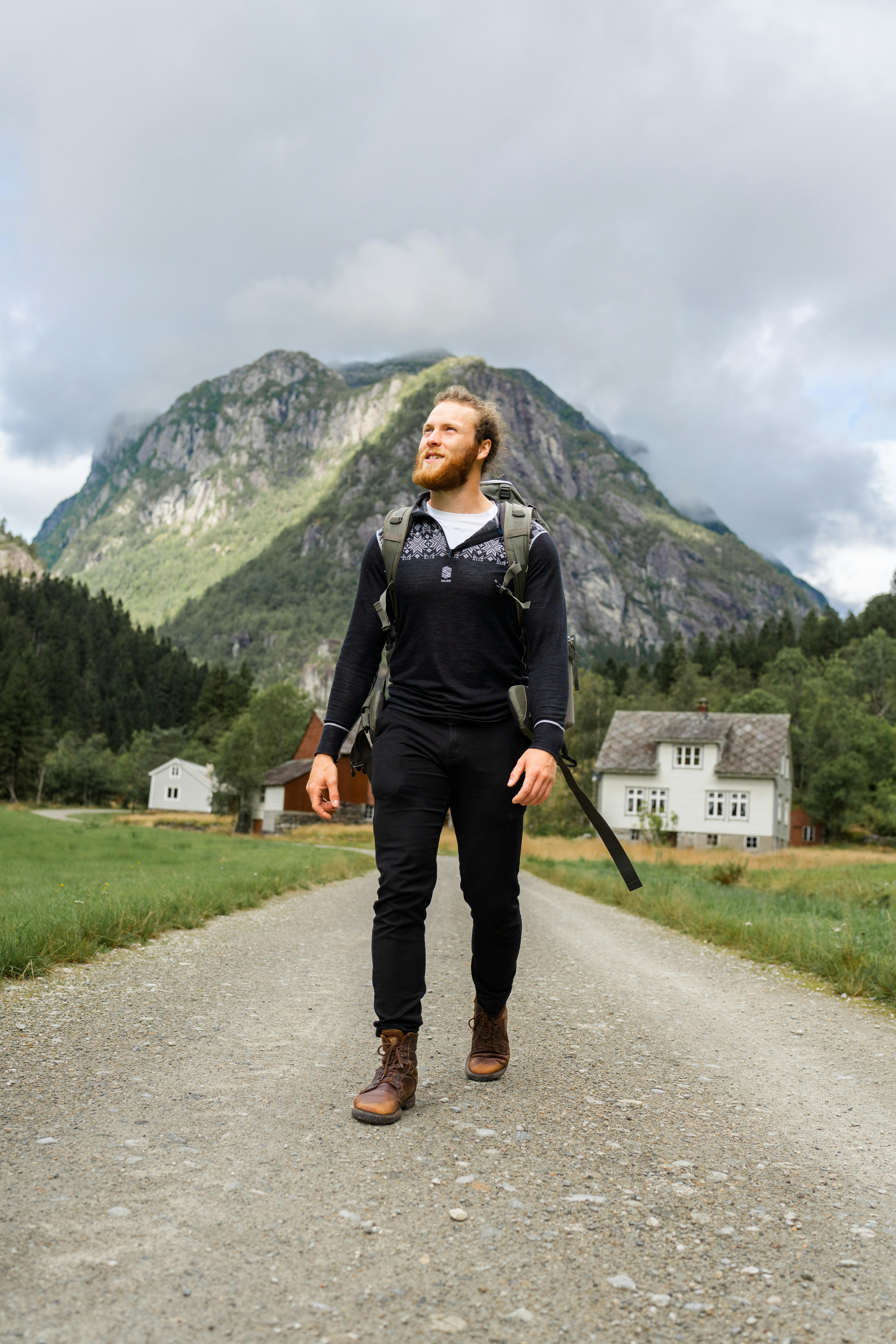 young bearded man on lonely hike in norway
